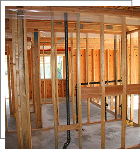 A room being built with wood framing and metal bars.